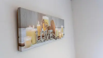 a picture of candles on a wall at The Riverside in Alloa