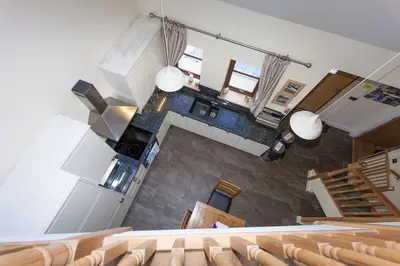 an overhead view of an auditorium with chairs and a staircase at Beech Cottage at Williamscraig Holiday Cottages in Linlithgow