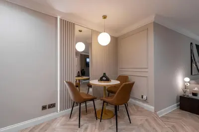 a dining room with a table and chairs at The Wilton Suite - Your Private 5* Escape! in Glasgow