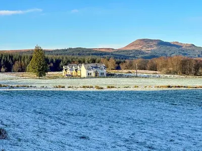 a house in the middle of a snow covered field at Fiadh Ruadh-Uk40008 in Gartmore