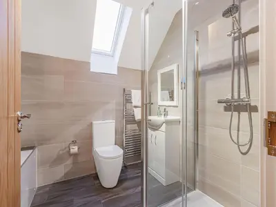 a bathroom with a toilet and a sink and a shower at Gartclach-Uk40001 in Gartmore