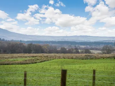 a field of green grass with a fence at Gartclach-Uk40001 in Gartmore