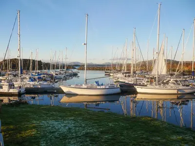 a group of boats docked in a harbor at Siskin Lodge - Uk39664 in Lunga