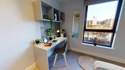 a room with a desk with a window and a chair at Studios and Ensuite Bedrooms with Shared Kitchen at Fountainbridge in Edinburgh in Edinburgh