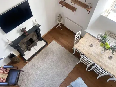 an overhead view of a living room with a fireplace at Creathie Cathcart - Georgian Luxury at the beach in Ayr