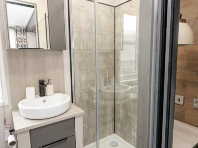 a bathroom with a shower and a sink at Hollybirch in Crieff