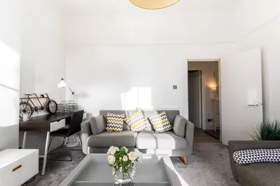 a living room with a couch and a table at GLASGOW WEST END 5 MIN WALK TO SECC AND HYDRO in Glasgow