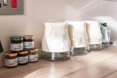 a row of vases and jars on a counter at GLASGOW WEST END 5 MIN WALK TO SECC AND HYDRO in Glasgow