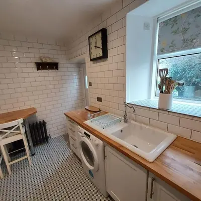 a kitchen with a sink and a washing machine at Lovely 1 Bed house in Largs, North Ayrshire in Largs