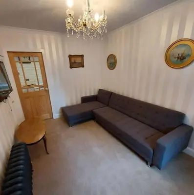 a living room with a couch and a table at Lovely 1 Bed house in Largs, North Ayrshire in Largs