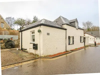 a white building on the side of a street at The Coach House in Oban
