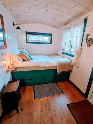 a small bedroom with a bed in a tiny house at The Best Moments Start Here in Corrie