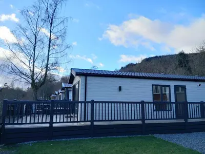 a house with a fence in front of it at Rowan in Crieff
