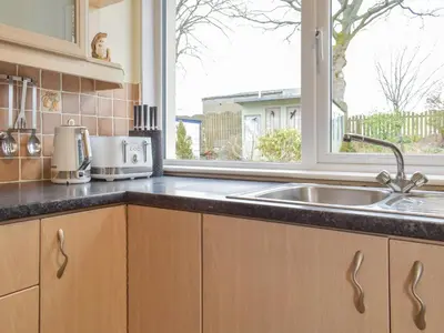 a kitchen with a sink and a window at The Shieling in Biggar