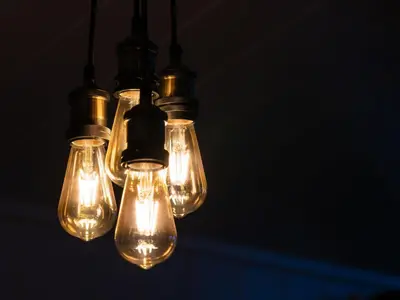 a group of light bulbs hanging from a ceiling at Chalet Loch Leven Lodge 25 East by Interhome in Kinross