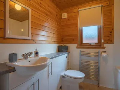 a bathroom with a sink and a toilet at Chalet Loch Leven Lodge 10 by Interhome in Kinross