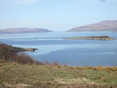 an island in the middle of a large body of water at Catkin Lodge - Uk39646 in Lunga