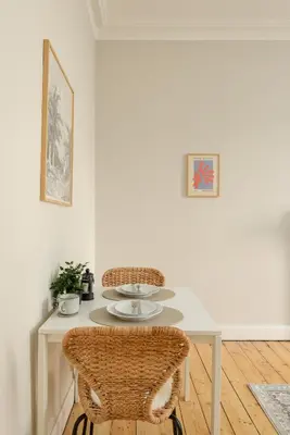 a dining room with a table and two chairs at The Stockbridge Snug by Calton Living in Edinburgh
