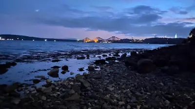 a group of rocks on a beach at night at Chilowen - Happy House in Inverkeithing