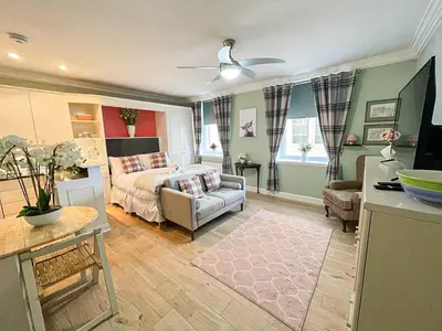 a living room with a bed and a couch at Snug Studio on The Grassmarket, 5mins from Castle in Edinburgh