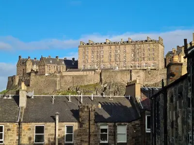 a large castle on the top of a building at Large 4 bed (sleeps 8) Castle View in Edinburgh