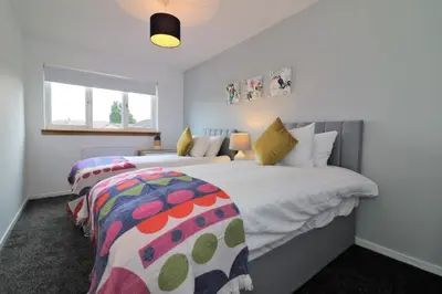 a bedroom with two beds and a window at Signature - Moore View in Hamilton