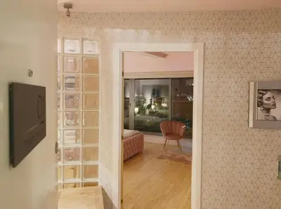 a room with a door leading into a living room at Designer Penthouse with Riverviews - G1 Glasgow City Centre, 3 Bedrooms, 2 Bathrooms, 1 Living room / Kitchen. Full Floor, Wrap Around Terrace, Panoramic Views, Off Central Station / Buchanan Street in Glasgow
