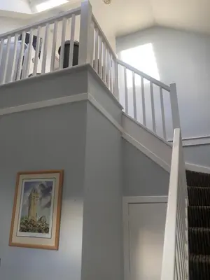a stairway with a stair case in a building at Netherby Guest House Edinburgh in Edinburgh