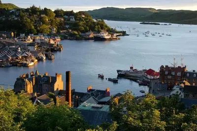a view of a harbor with boats in the water at Strathisla Garden Apartment, Oban in Oban