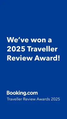 a blue sign that says weve won a traveler review award at Paisley Pad Glasgow Gateway second floor flat in Paisley