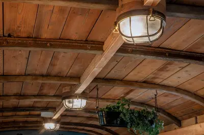a group of lights hanging from a wooden ceiling at The Carriage at Creagan in Creagan
