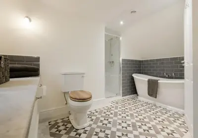 a bathroom with a toilet and a bath tub at Stroan in New Galloway