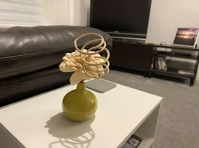 a green vase on a table in a living room at 5 minutes from Loch Lomond - Newly Renovated Ground Floor 1-Bed Flat in Bonhill
