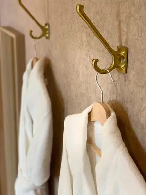 a pair of white shirts hanging on a wall at Lomond View in Luss