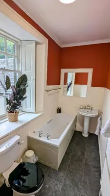 a large bathroom with a tub and a sink at Mid Cottage at Powis House Estate in Stirling